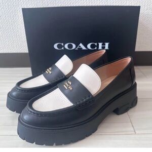 NWOT Coach Two-Tone Black and Cream Loafers never worn.